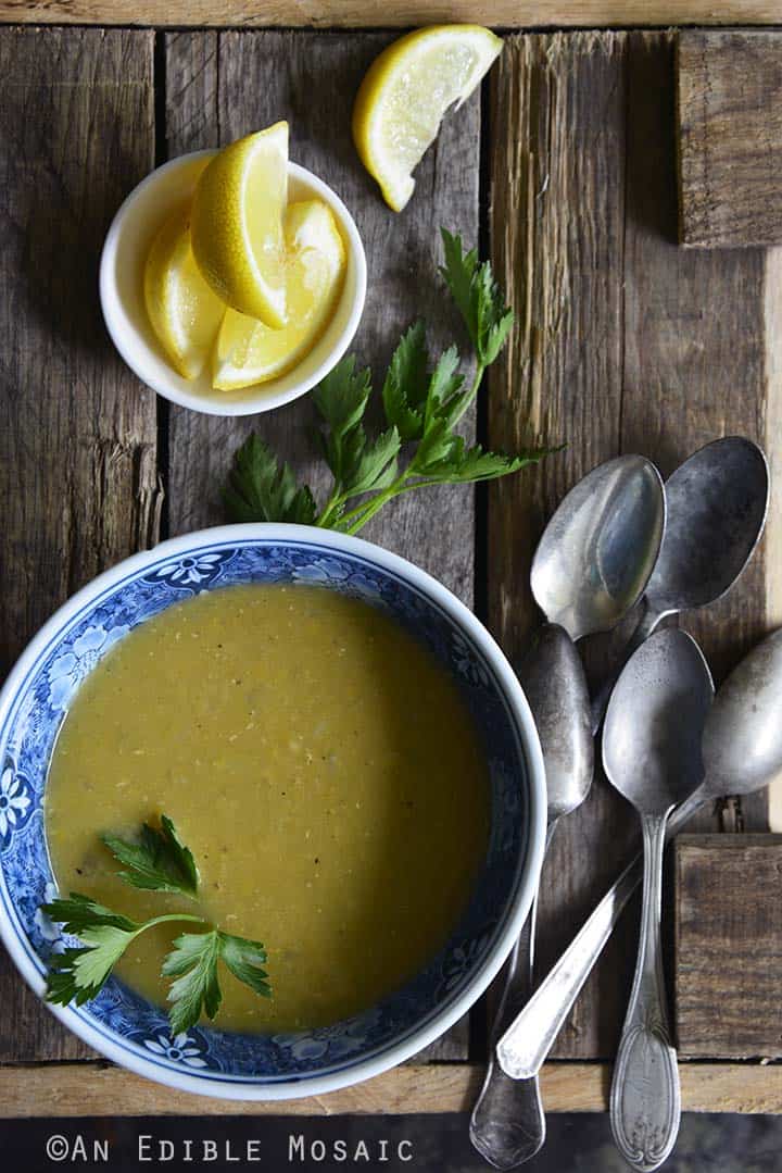 Overhead View of Red Lentil Soup on Wooden Table with Vintage Spoons