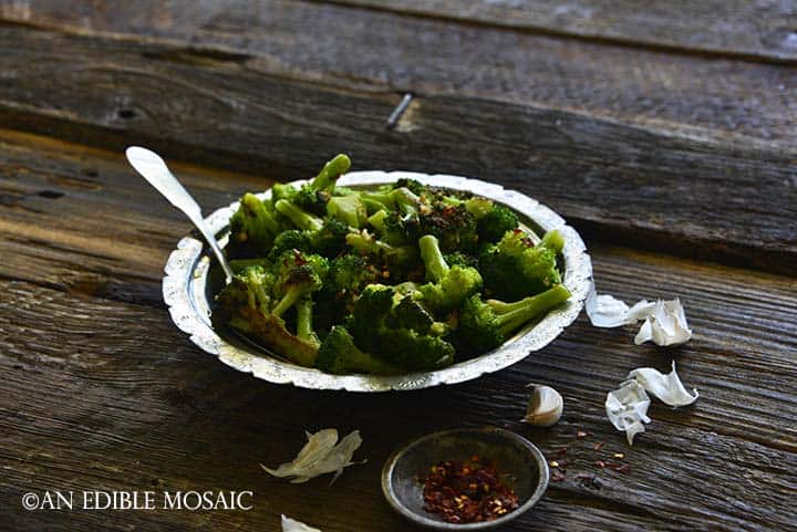 Front View of Spicy Italian Broccoli in Bowl with Crushed Red Pepper Flakes