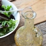 Best Dressing for Salad in Glass Bottle on Wooden Table
