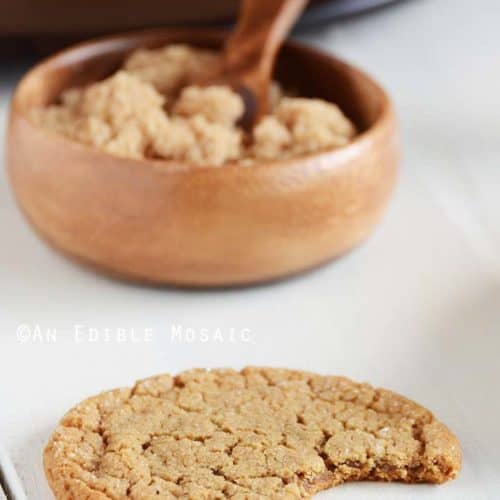 Molasses Cookies on White Wooden Table with Brown Sugar in Background