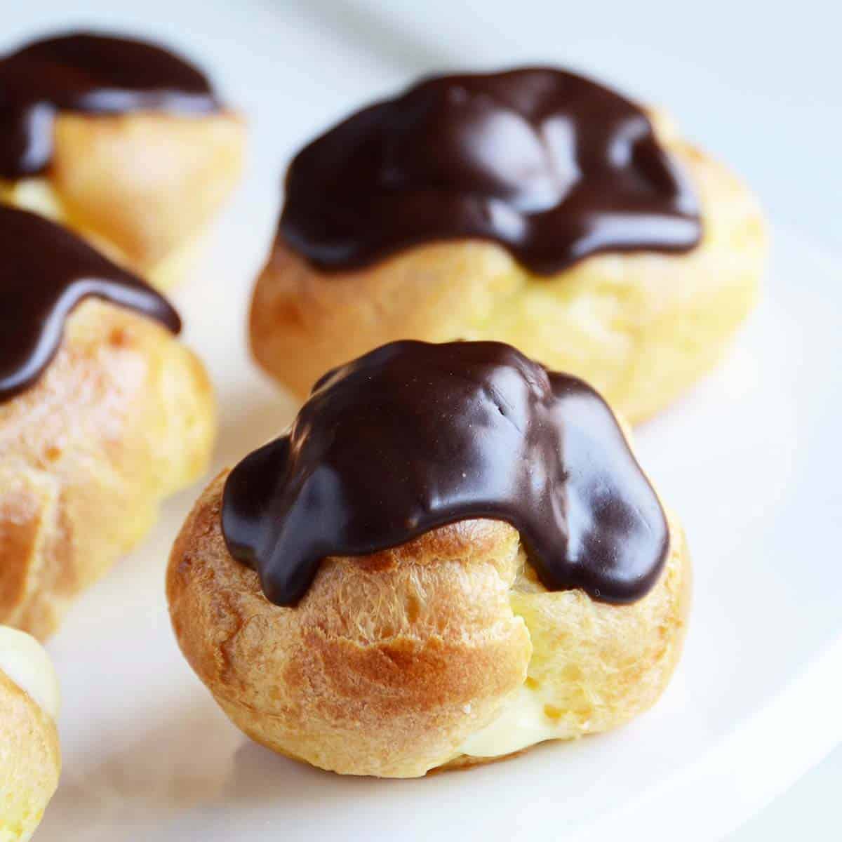 Profiteroles Recipe Choux Pastries with Vanilla Cream and Chocolate Icing