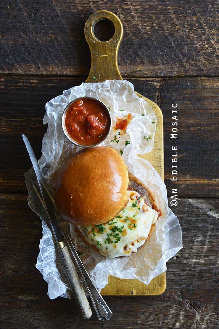 Top Down View of a Pizza Burger on a Wooden Board