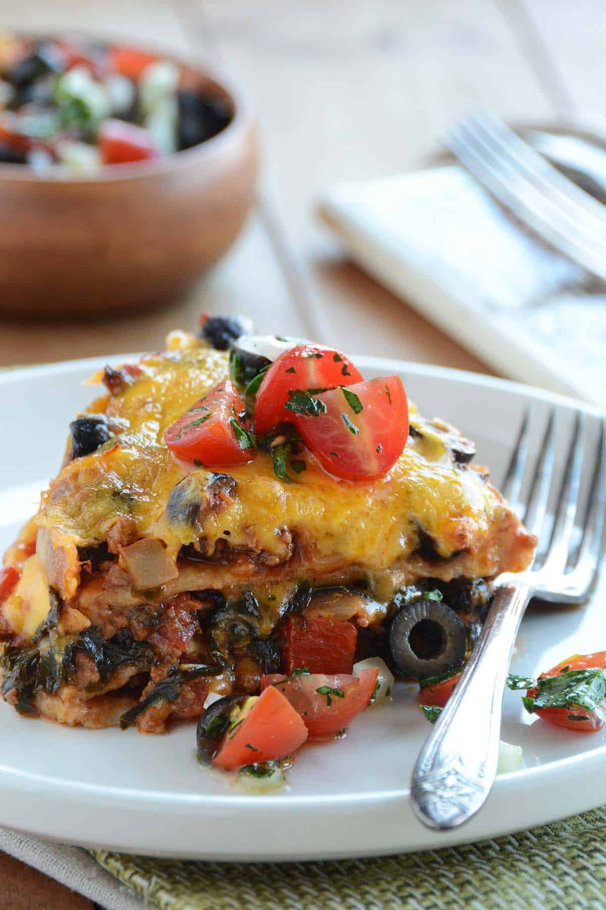 front view of slice of taco pie on plate