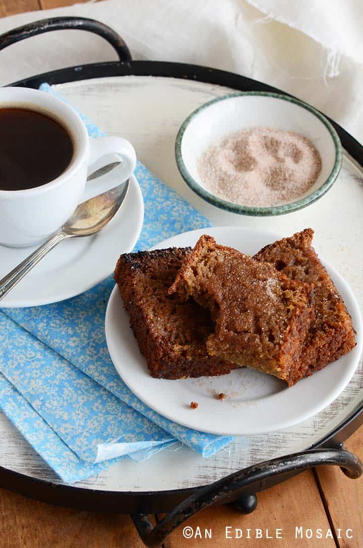 Homemade Cinnamon Bread on White Plate on Blue Fabric on Breakfast Tray