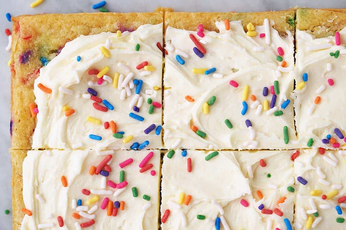 close up top view of funfetti birthday cake blondies on marble counter