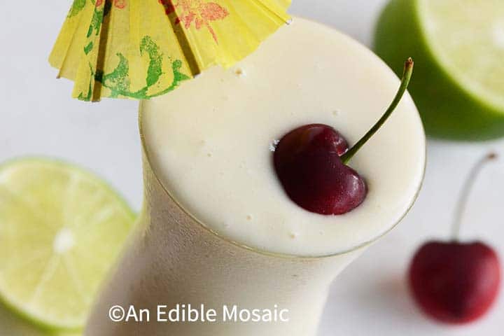 Close Up of Pina Colada Smoothie with Fresh Cherry