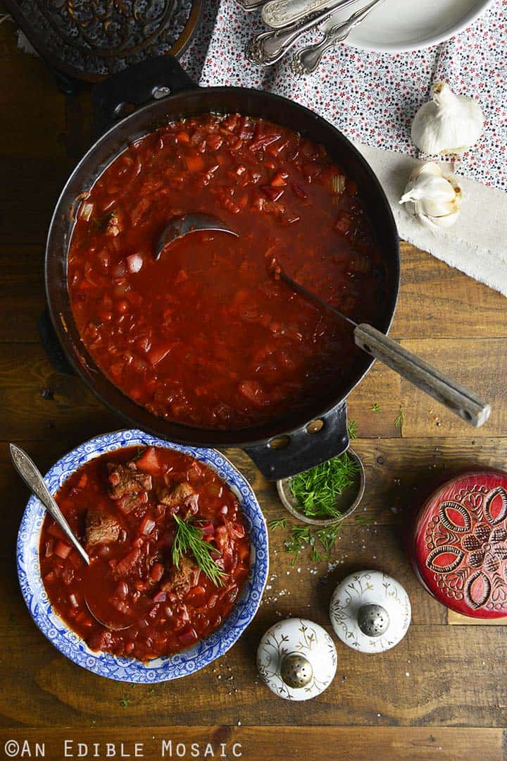 Ladeling Borscht From Pot Into Serving Bowl