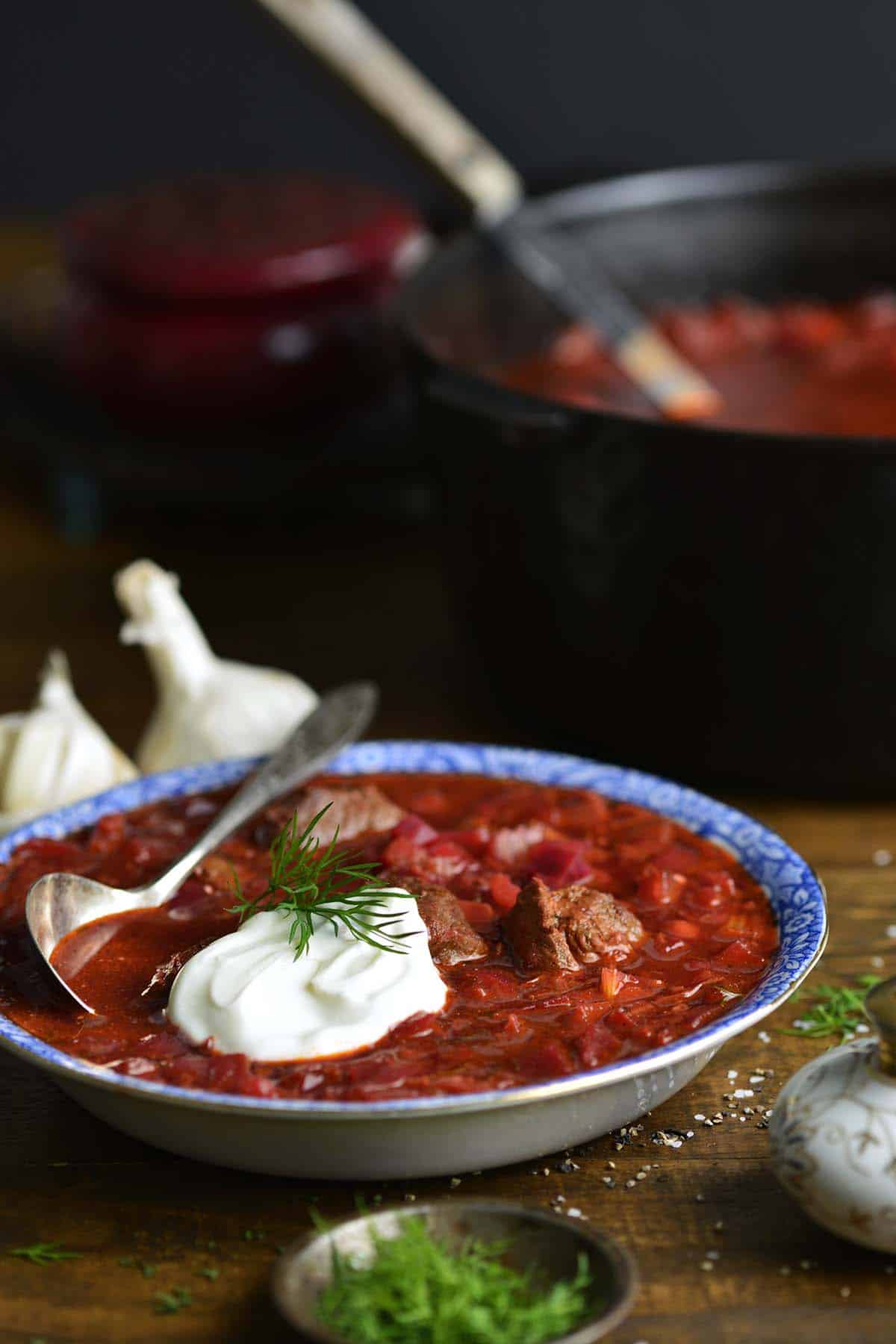 bowl of classic borscht topped with sour cream