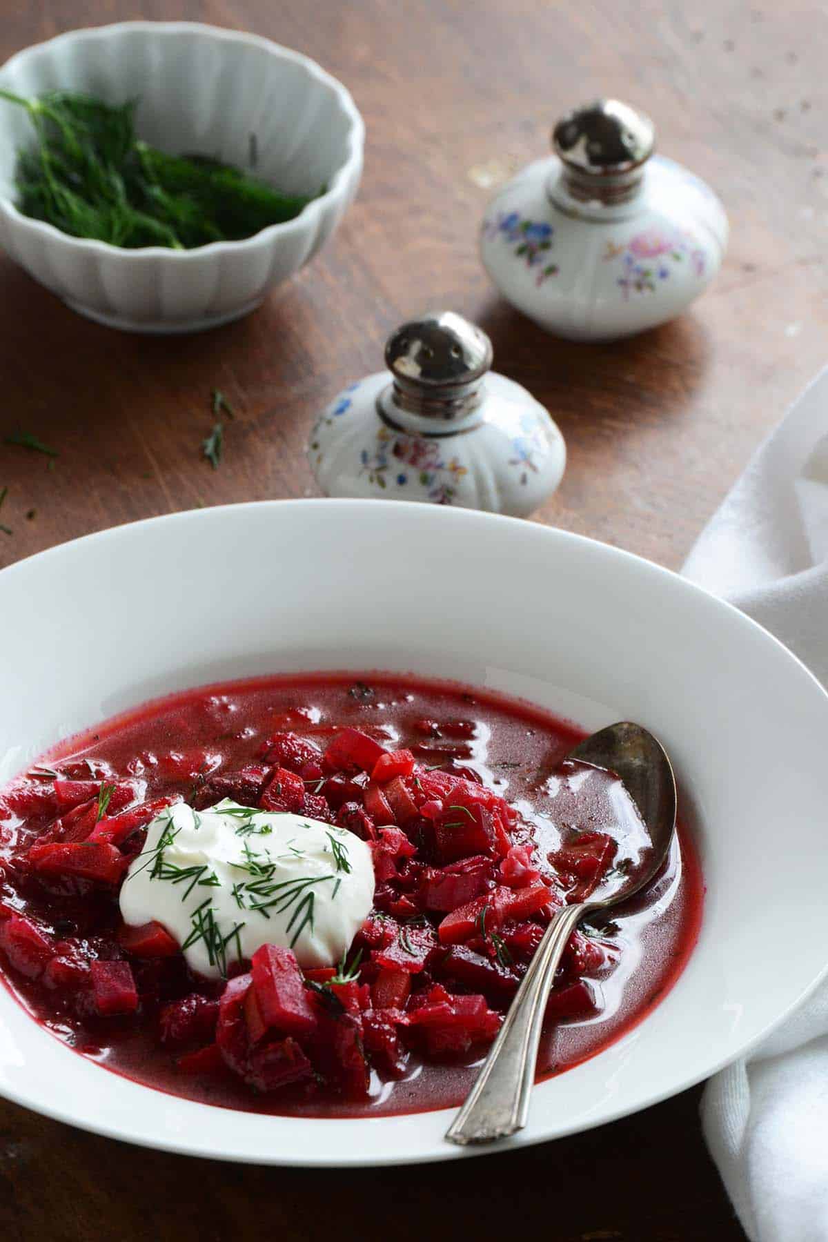 front view of classic borscht in white bowl