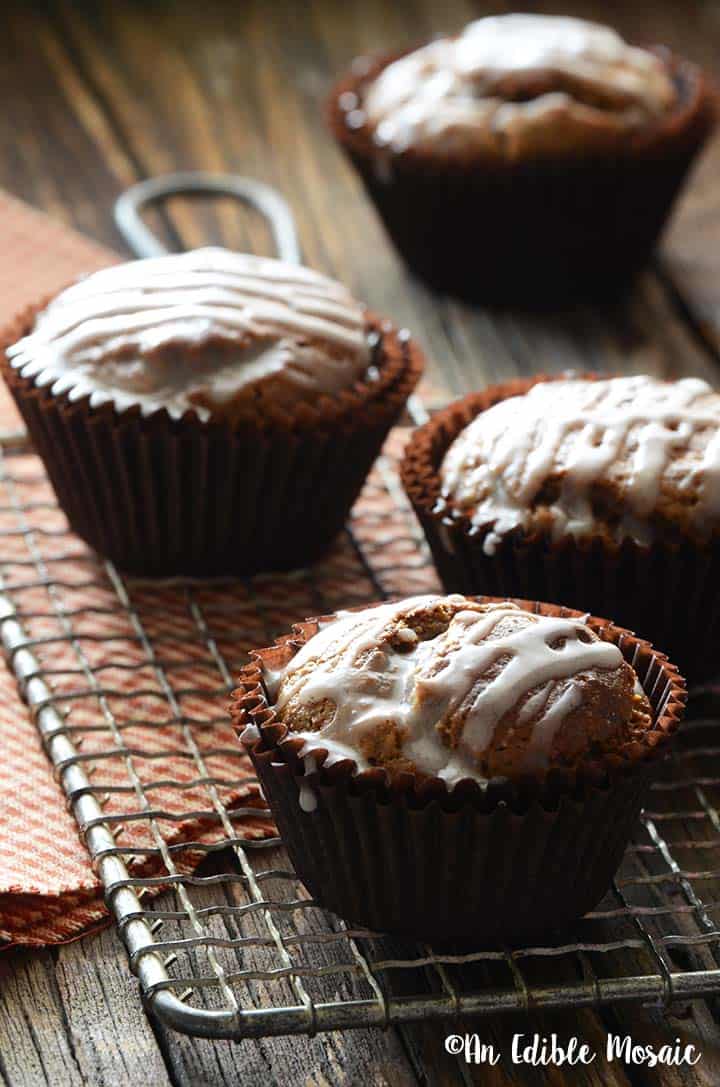 Front View of Gingerbread Muffins on Wooden Table with Red Linen and Wire Rack