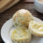 Savory Scones with Scallion and Cheese on Small White Plate on Wooden Table