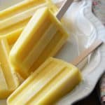 Close Up Front View of Vanilla Pineapple Popsicles on White Platter