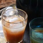 glass of homemade wood apple juice with ice