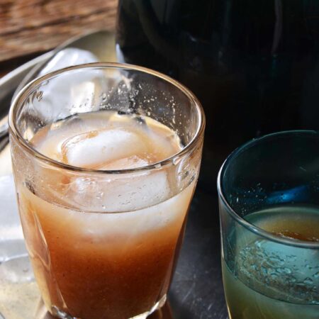 glass of homemade wood apple juice with ice