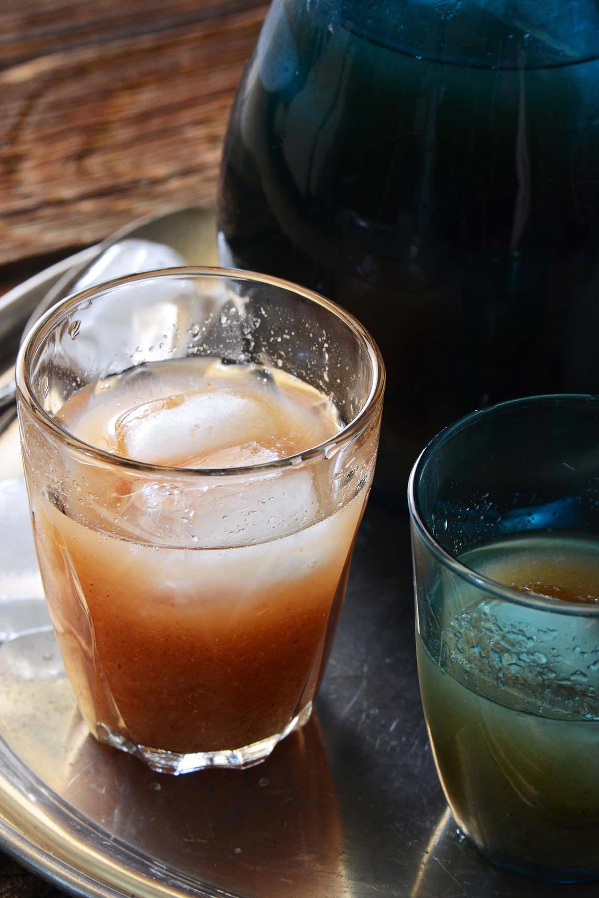 glass of homemade wood apple juice with ice