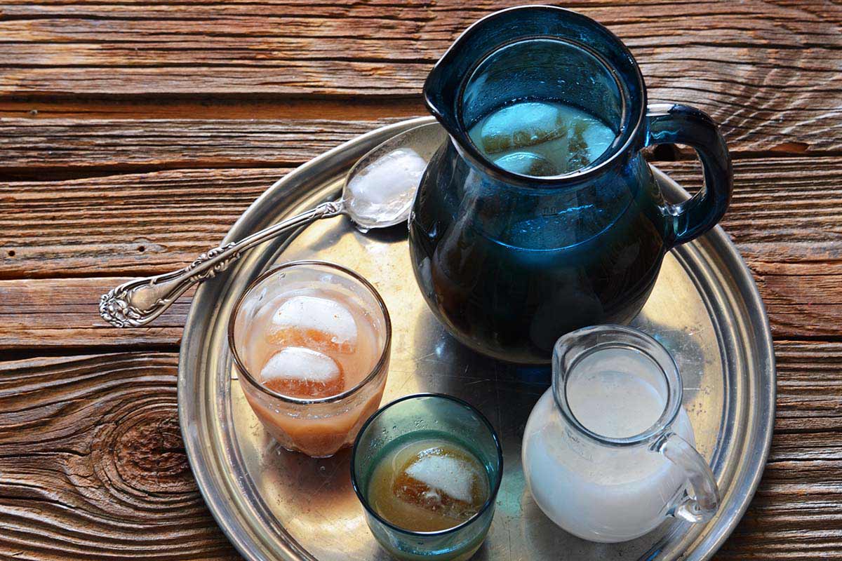 Indian wood apple juice on serving tray with coconut milk