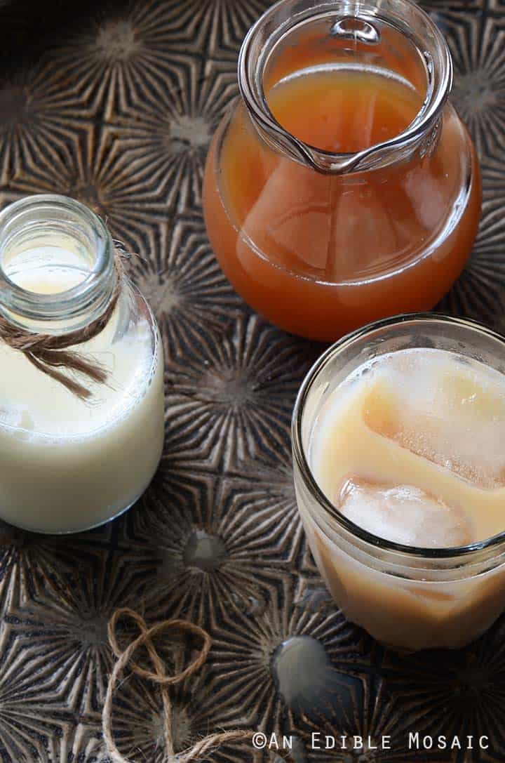 Chai Masala Recipe in Glass Jug with Iced Chai Latte on Tray