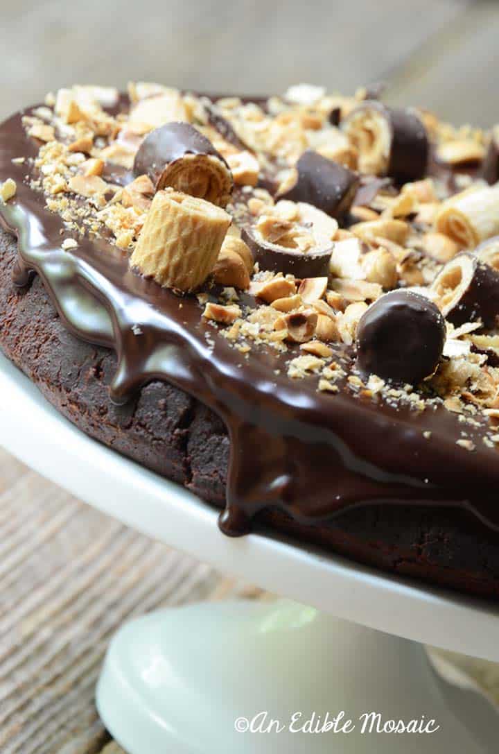 Side View of Chocolate Hazelnut Cake Showing Chocolate Ganache Drip