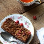 Slice of Paleo Cranberry Bread on Small Flowered White Plate with Vintage Spoon