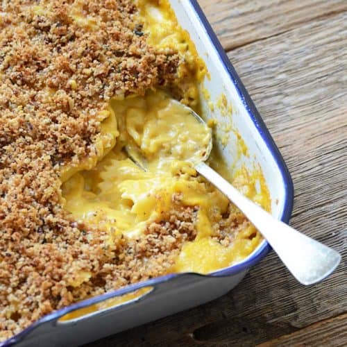 Pumpkin Mac and Cheese in White Casserole Dish with Spoon