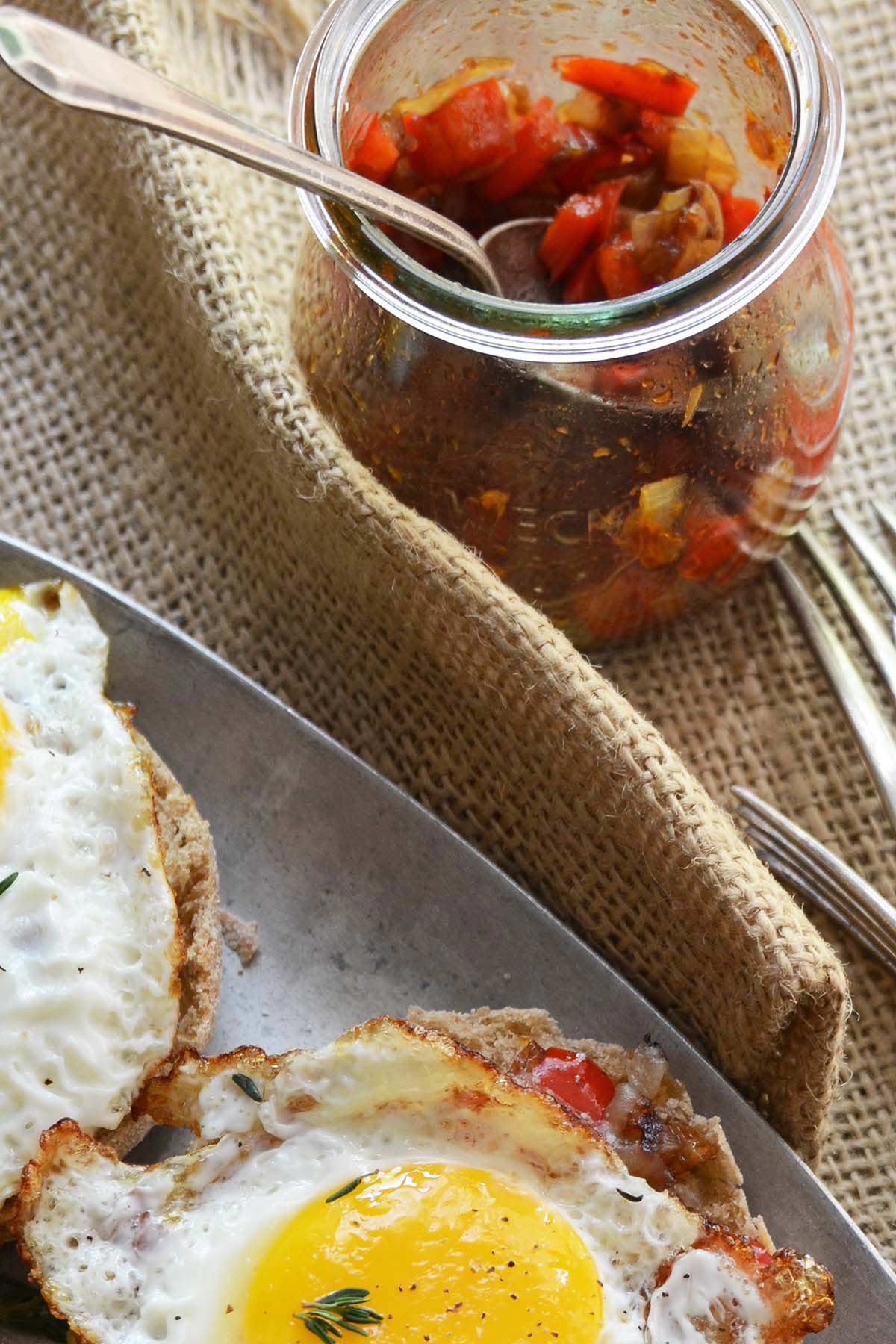 smoky red pepper compote in weck jar as part of brunch spread with eggs