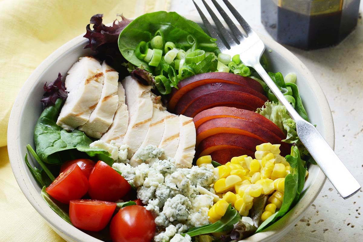 close up of simple grilled chicken salad recipe with blue cheese and corn