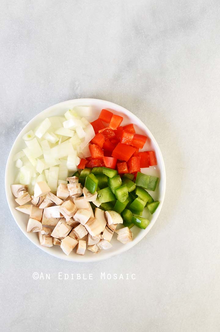 Chopped Vegetables for Western Omelet on White Plate