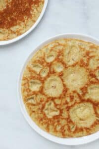 cropped-overhead-view-of-2-paleo-flatbreads-on-white-plates-on-marble-counter.jpg