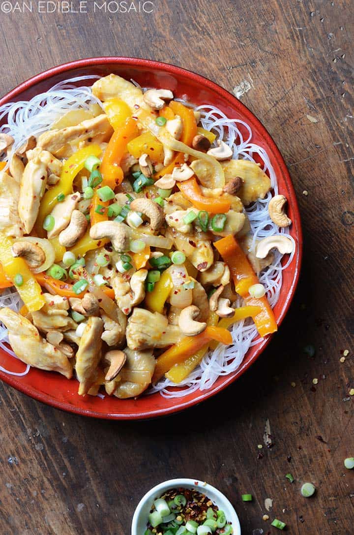 orange chicken stir fry on vermicelli rice noodles