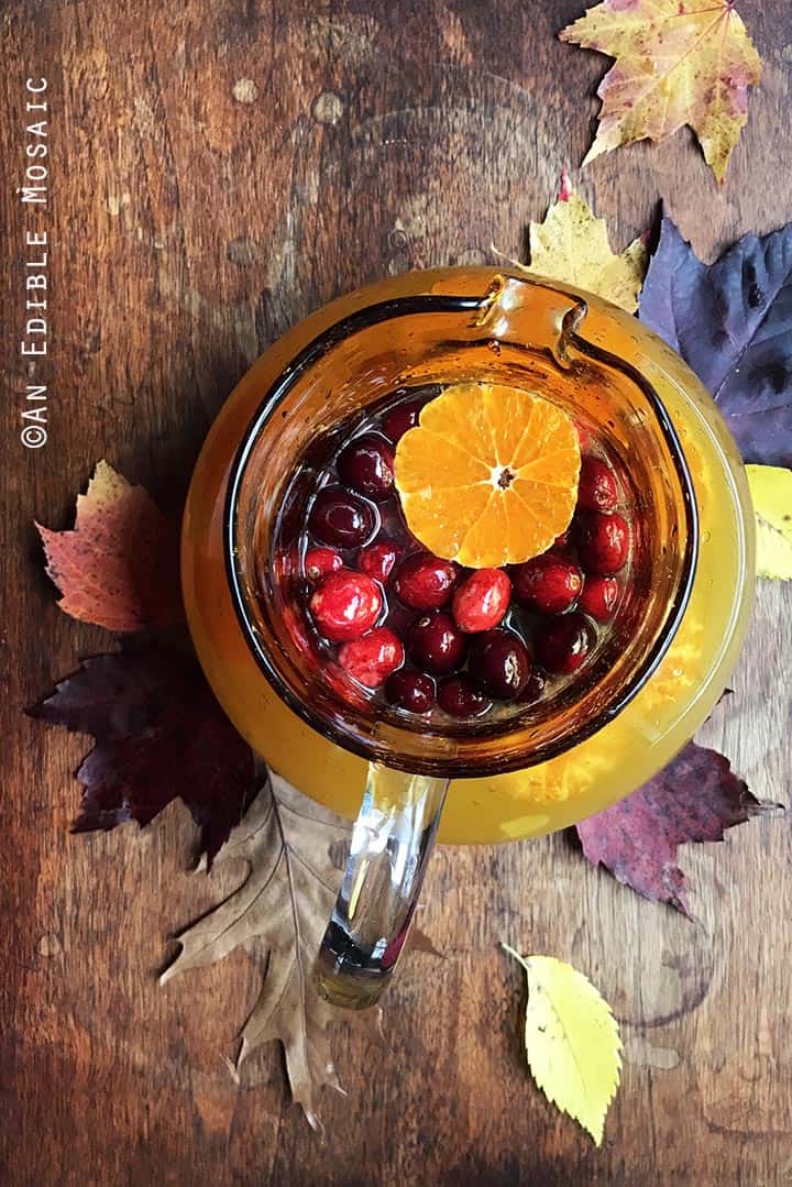 Tangerine Lemonade with Clove-Infused Simple Syrup and Fresh Cranberries