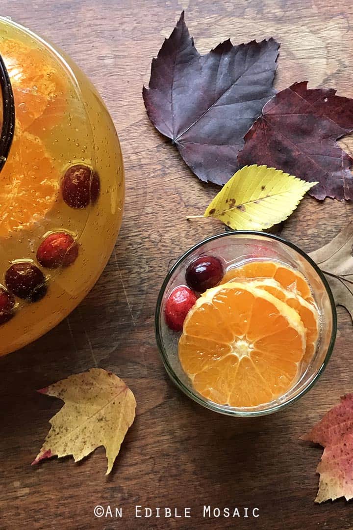 tangerine-lemonade-with-clove-infused-simple-syrup-and-fresh-cranberries-2