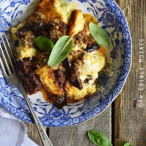 Low Carb Moussaka in Blue and White Flowered Dish on Wooden Table