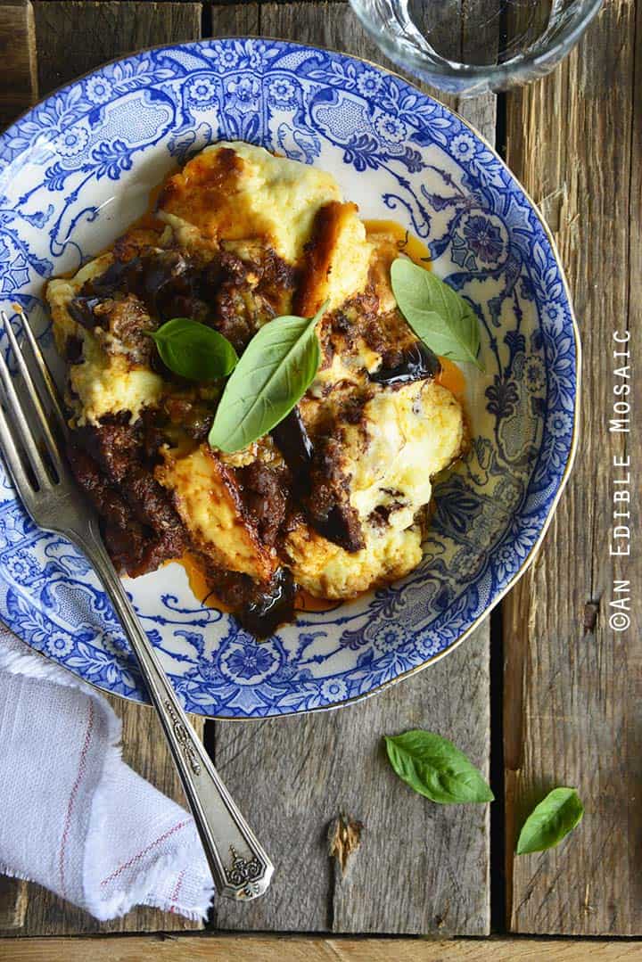 Low Carb Beef Eggplant Moussaka Casserole (Gluten Free) in Dish on Rustic Wooden Table