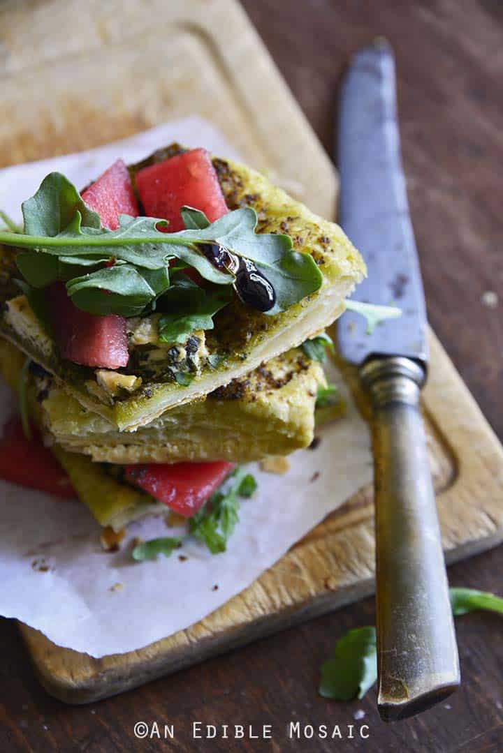 Garlic and Chive Goat Cheese and Pesto Puff Pastry Tart with Arugula, Watermelon, and Strawberry-Balsamic Drizzle - Close Up