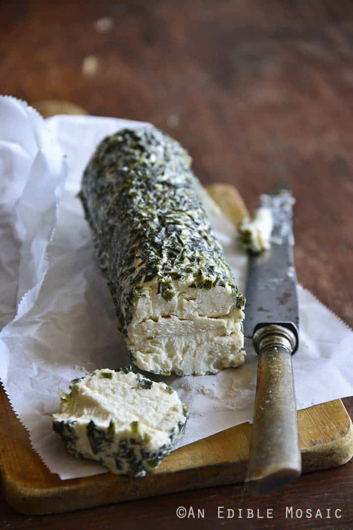 Laura Chenel's Garlic & Chives Goat Cheese on a Wooden Board - Front View