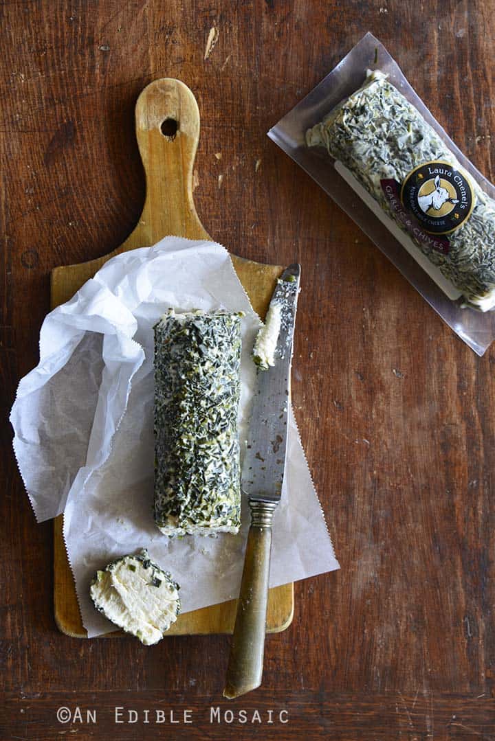 Laura Chenel's Garlic & Chives Goat Cheese on a Wooden Board - Top View