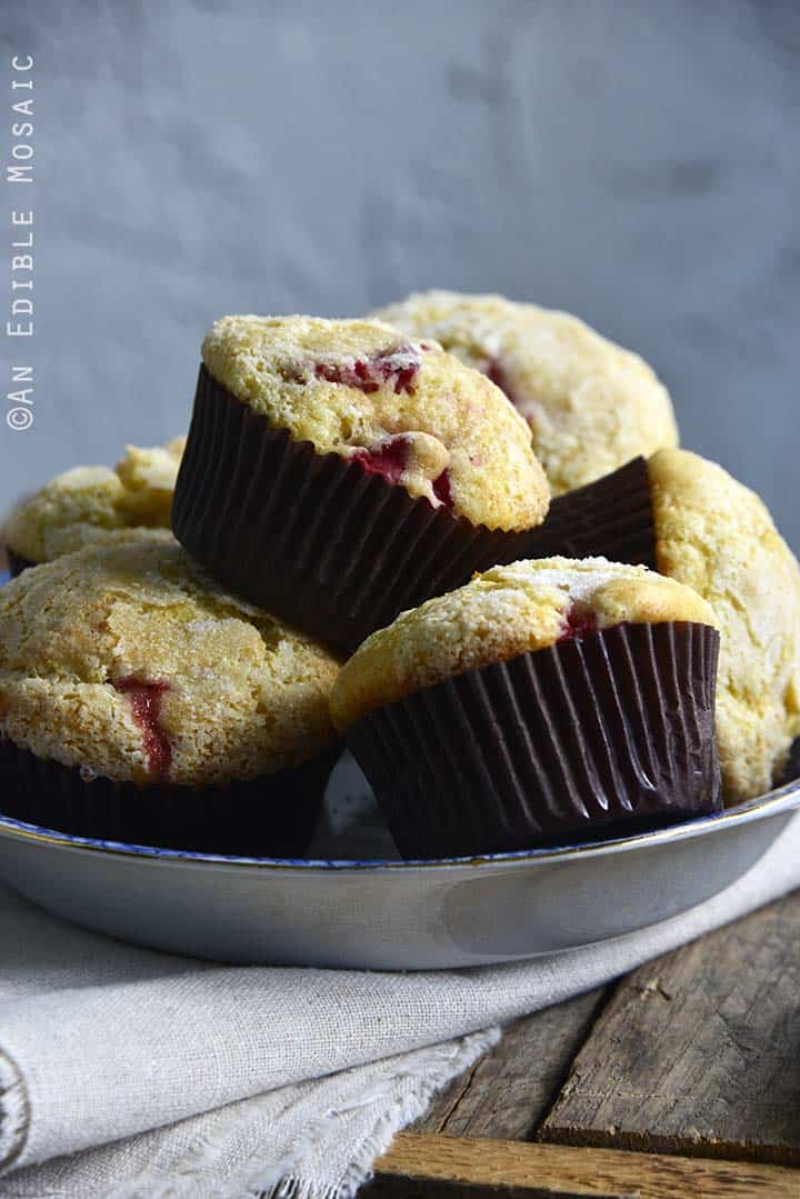 Front-Facing View of Strawberry Lemonade Muffins in a Blue Bowl on a Wooden Background