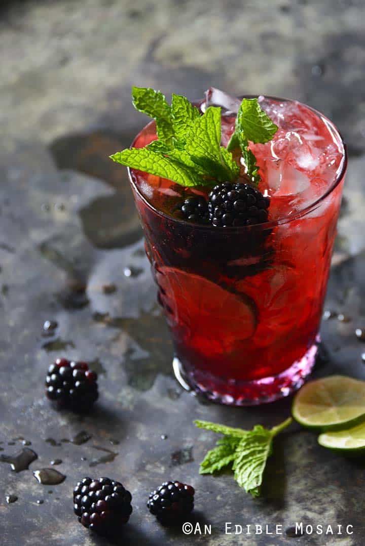 Blackberry Syrup, Mint, and Lime Spritzers on Metal Tray Front View Vertical Orientation