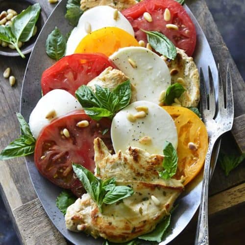 Chicken Caprese Recipe with Lemon and Thyme on Metal Platter on Top of Rustic Wooden Crate