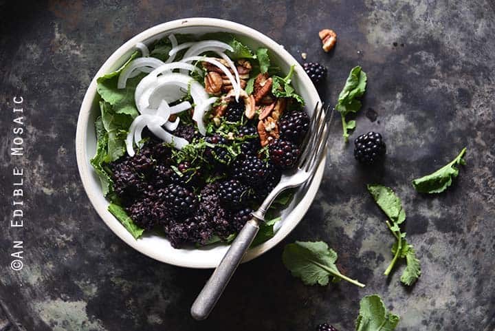 Vegan Herbed Black Rice, Black Lentils, and Black Quinoa Pilaf Salad Bowls with Blackberries on Weathered Metal Background Top View Horizontal Orientation