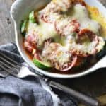 15-Minute Low-Carb Zucchini Pizza Bake for One in White Casserole Dish on Wooden Table