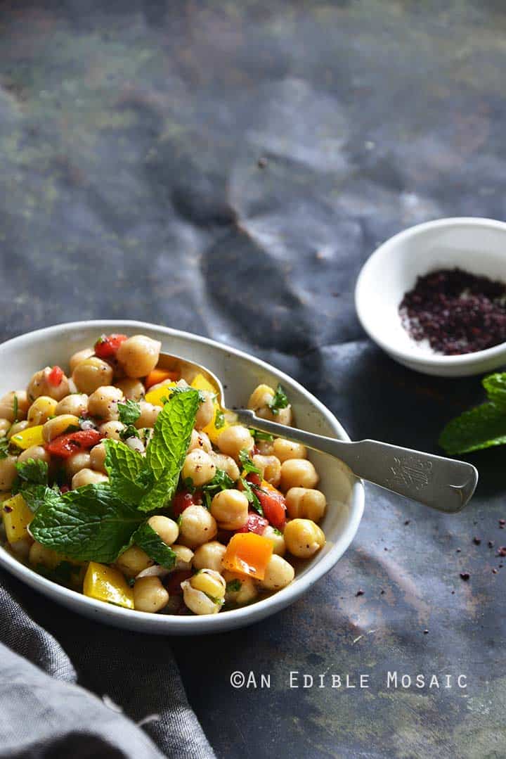 Sweet Pepper Chickpea Salad with Mint and Honey-Sumac Vinaigrette Front View Metal Background Vertical Orientation