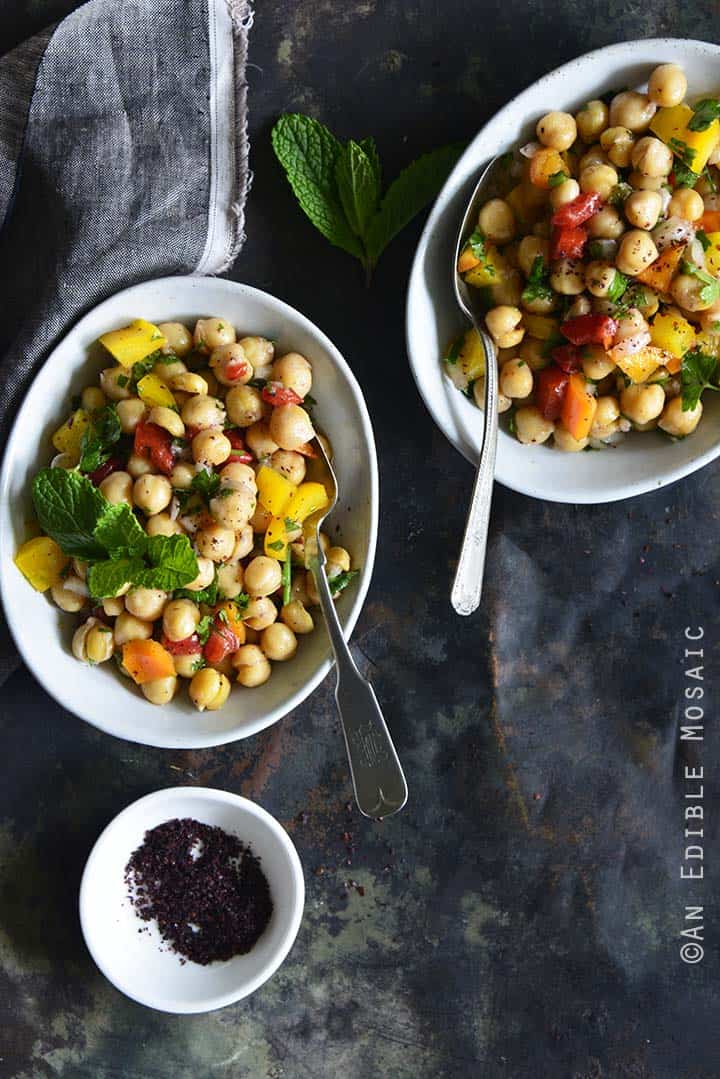 Sweet Pepper Chickpea Salad with Mint and Honey-Sumac Vinaigrette Top View Metal Background Multiple Dishes