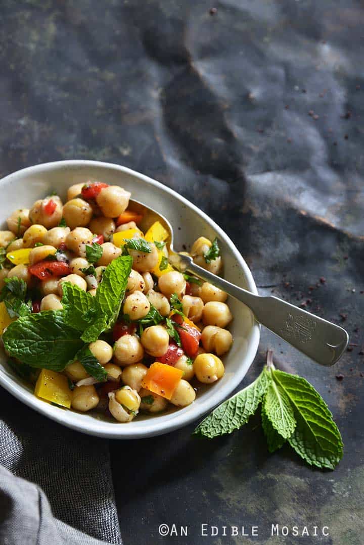 Sweet Pepper Chickpea Salad with Mint and Honey-Sumac Vinaigrette Front View Metal Background Vertical Orientation