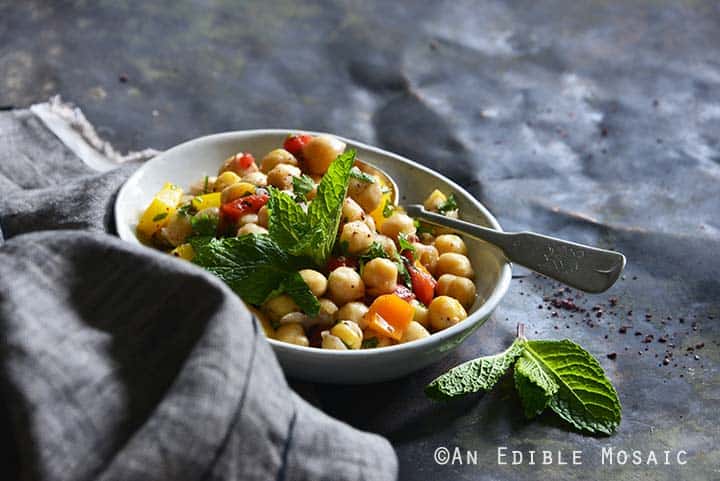 Sweet Pepper Chickpea Salad with Mint and Honey-Sumac Vinaigrette Front View Metal Background Horizontal Orientation