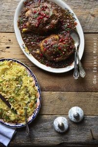 Persian Inspired Cornish Hens with Pomegranate Walnut Sauce with Golden Pilaf on Wooden Table