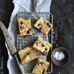 Salted Peanut Butter and Chocolate Snickers Brown Butter Blondies Overhead View on Metal Tray