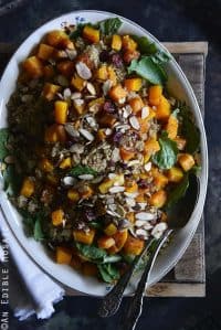 Sweet and Savory Quinoa Pilaf with Cranberries, Roasted Butternut Squash, and Toasted Almonds Top View on Wooden Crate Vertical Orientation