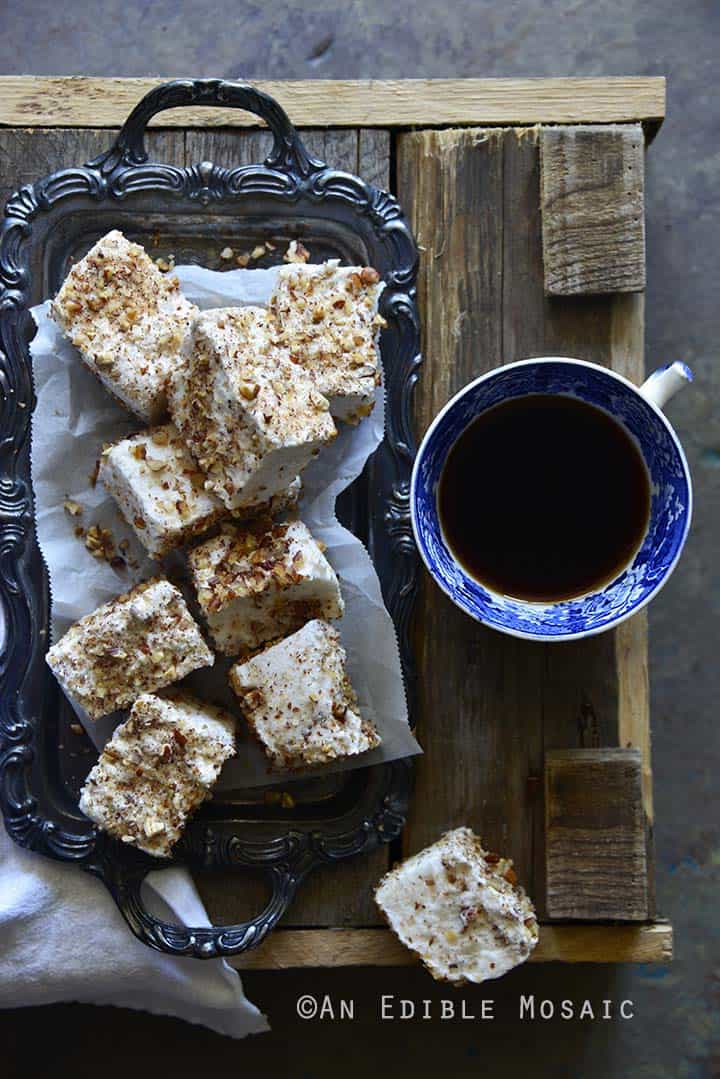 Vanilla Bean and Maple Toasted Pecan Marshmallows on Metal Tray on Wooden Table with Coffee