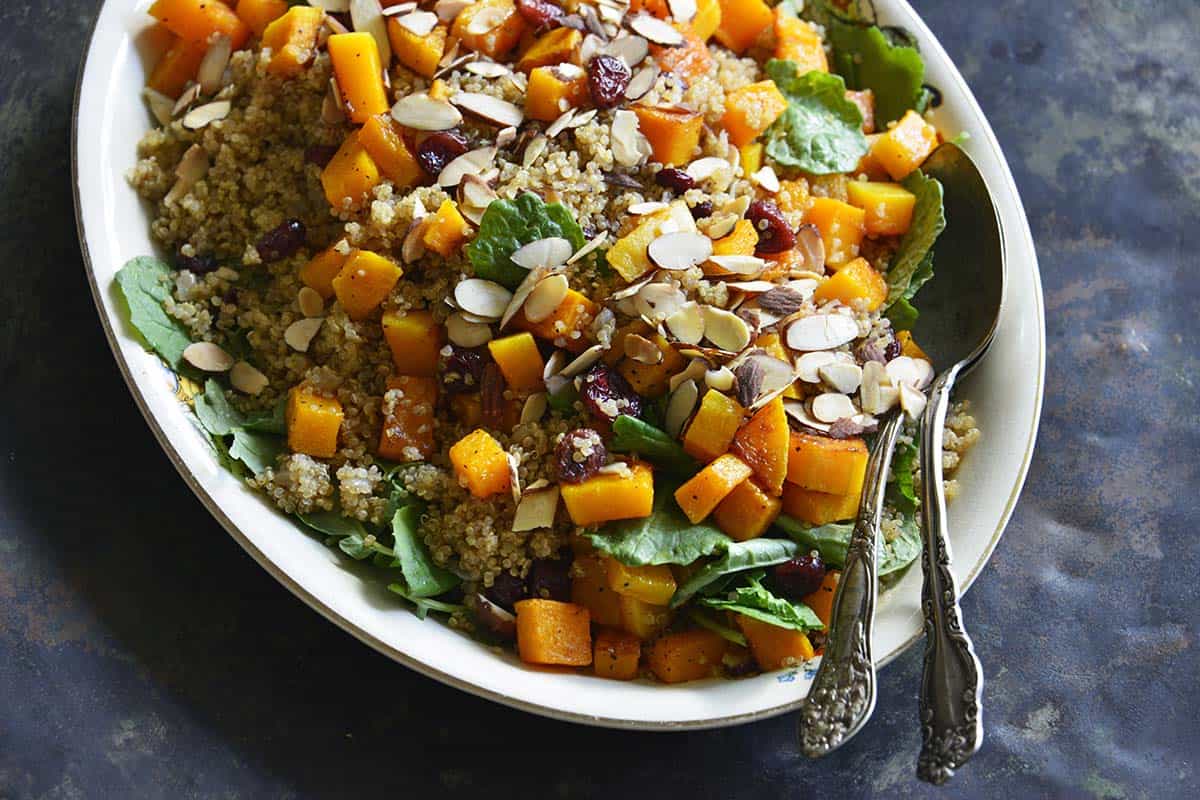 serving platter with butternut squash and quinoa salad with cranberries and almonds